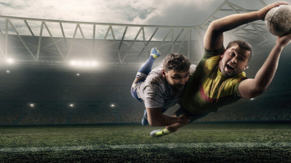 Two,Male,Rugby,Players,Fight,For,The,Ball,In,Flight