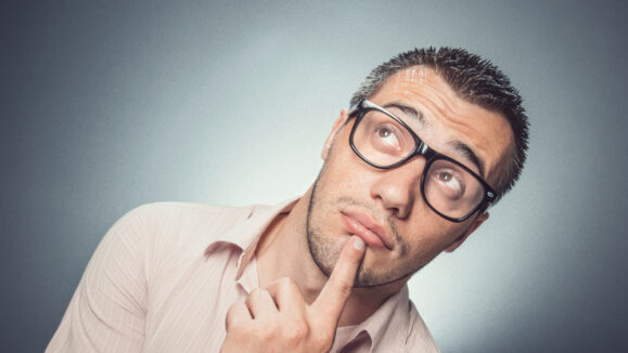 Worried,Young,Businessman,Looking,Up.,Confused,Man,With,Eyewear,Thinking