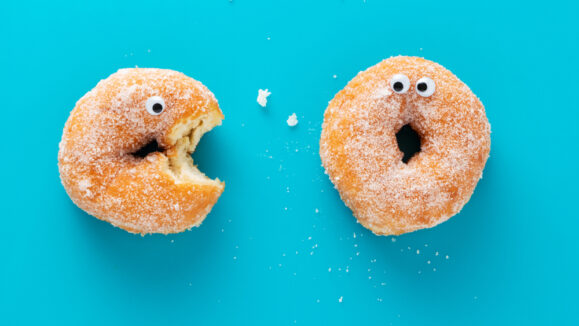 Funny,Doughnuts,With,Eyes,,Cartoon,Like,Characters,,On,Blue,Background.