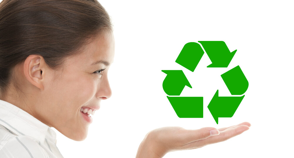 Recycling,Woman,Holding,The,International,Icon,/,Symbol,For,Recycling.