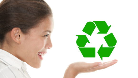 Recycling,Woman,Holding,The,International,Icon,/,Symbol,For,Recycling.